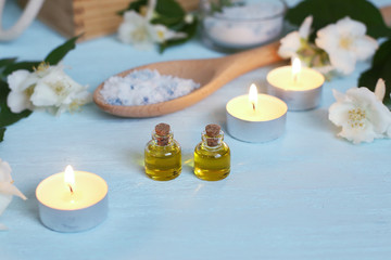 Aromatic oils, sea salt, candles and jasmine flowers. Spa ingredients for massage and relaxation.