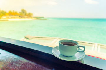Coffee cup with Beautiful tropical Maldives island .  ( Filtered image processed vintage effect. )