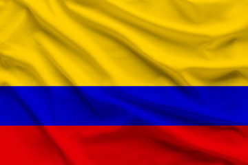 Fototapeta premium silk national flag of Colombia with folds