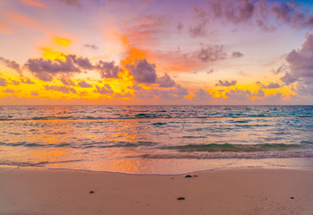 Naklejka na ściany i meble Beautiful sunset with sky over calm sea in tropical Maldives island .