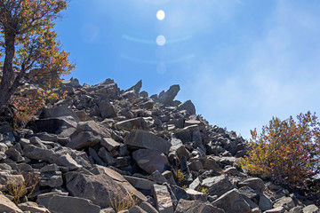 Mountain landscape with grey rocks and stones and blue sky in La Campana National park, Chile, South America