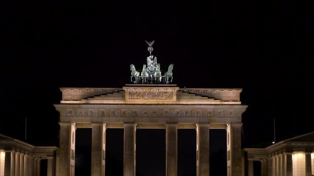 Tilt up 4K Video clip of people at night by The Brandenburg Gate, Pariser Platz, Berlin, Germany