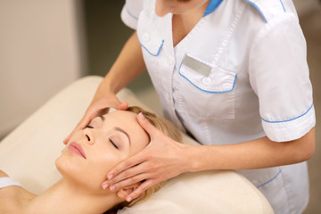 Obraz na płótnie Canvas Businesswoman feeling truly relieved having face massage