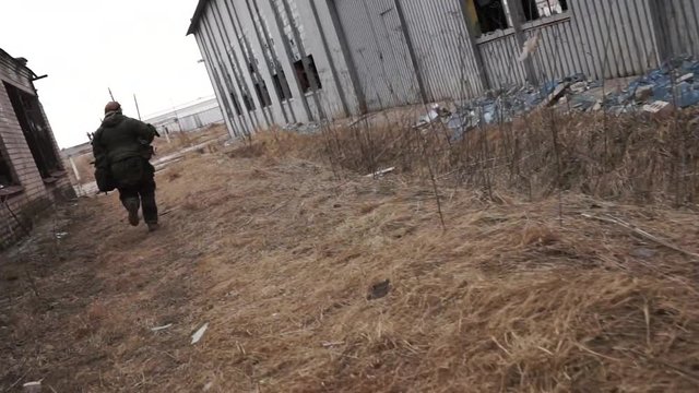 Military concept. Ruined army base. war concept. ruined house, runing soldier,  hostilities, shelling, rafale