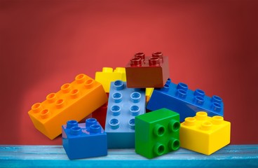 Clorful bricks toys on blue wooden desk