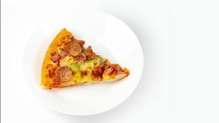 The remaining pizza is in the plate.Close-up pizza is in dish. Top view