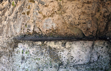 rock background. fracture of stone surface. the impact of nature on the stone