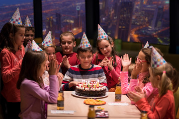 happy young boy having birthday party