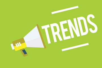 Conceptual hand writing showing Trends. Business photo showcasing general direction in which something is developing or changing Megaphone green background important message speaking loud