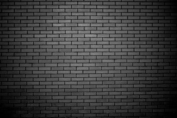 uniform modern gray brick wall close-up with vignetting. texture background wallpaper