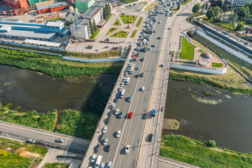 Aerial view of Tula city center or downtown with bridge over river Upa, modern and historic buildings, factories and car traffic