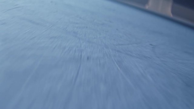motion along rink and goal in gate view from hockey puck