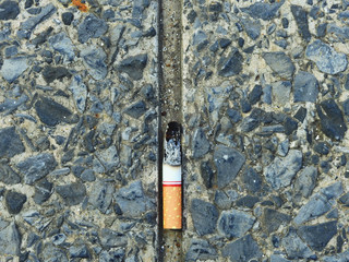discard cigarette butts on street floor