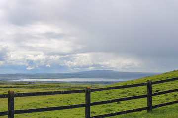 Fototapeta na wymiar Wooden fence in a field. Ireland