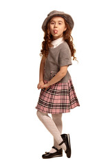 Full length shot of a lovely little kid with a long, curly hair posing isolated on white background.