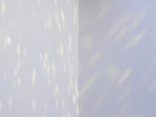 light and shadow bokeh on white wall