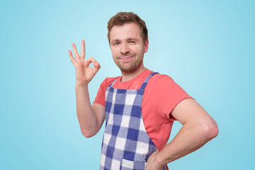 mature restaurant employee man show ok sign
