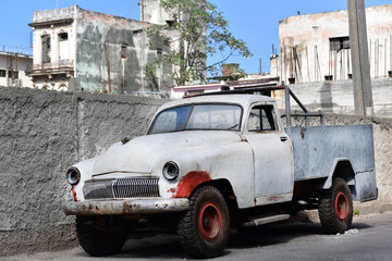 Very old white truck parked in the street of Havana Vieja, Cuba