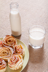 Glass, bottle of milk and plate with homemade biscuits.