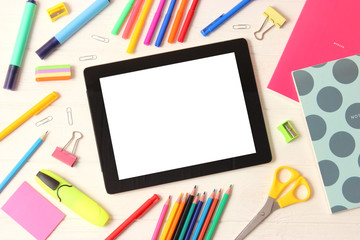 Modern digital tablet and school stationery on a colored background top view. Kontpt back to school. Place for text. - Powered by Adobe