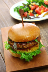 homemade vegan burger isolated on wooden background