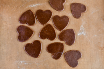Chocolate hearts on background. Chocolate heart on wooden background