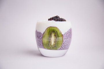 black chia pudding with blackberry and kiwi