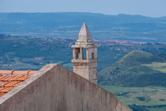 The village of Osilo, overlooking the fertile Anglona hills sloping down to the sea, province of Sassari , Sardinia, Italy.
