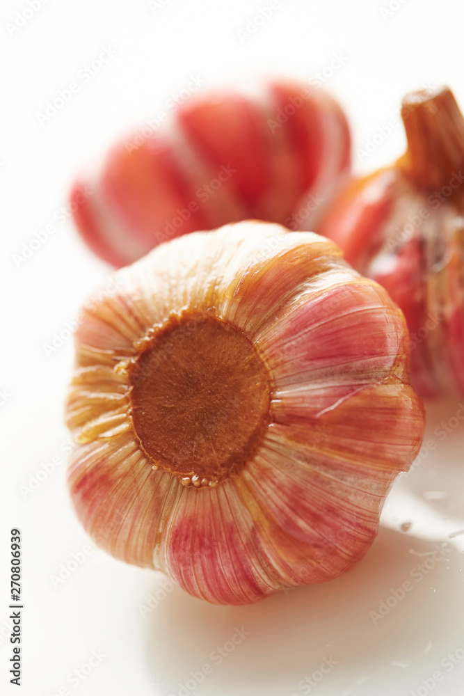 Sticker Pickled garlic cloves on white background 