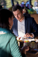 youn couple enjoying lunch at restaurant