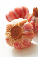 Pickled garlic cloves on white background 