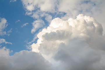 Large gray and white cloud against the blue sky