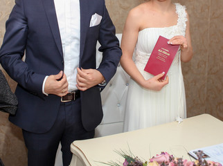 Bride shows family registry (Aile Cuzdani in Turkish) just after gets it from marriage registrar.