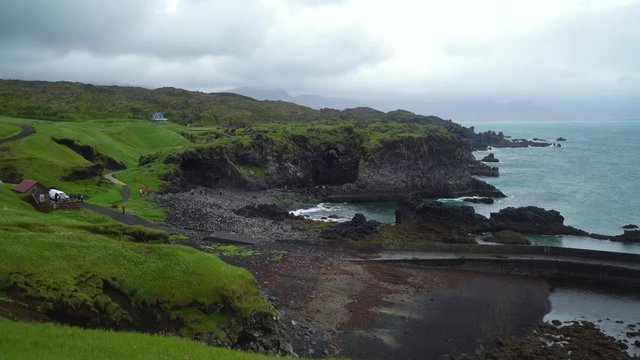 Rocky coastline landscape in Hellnar, Iceland. Hellnar was among the largest fishing villages beneath the Snaefellsjokull ice cap in West Iceland.