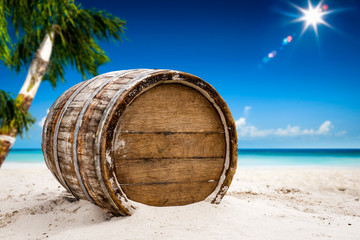 Fototapeta premium Wooden old retro barrel on beach and summer landscape of ocean 