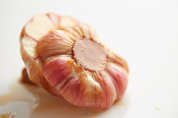 Pickled garlic cloves on white background 