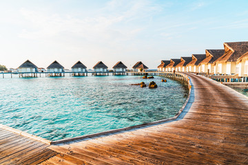 Beautiful tropical Maldives resort hotel and island with beach and sea