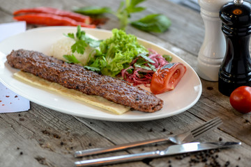 meat dish lula kebab on a white plate