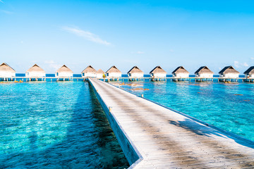 Beautiful tropical Maldives resort hotel and island with beach and sea