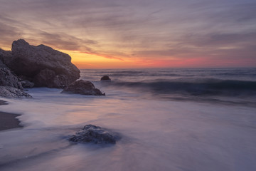 Fototapeta na wymiar Quiet beach in the sunrise