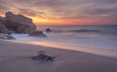 Fototapeta na wymiar Quiet beach in the sunrise