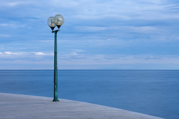 Light on sidewalk in coast town of Porec