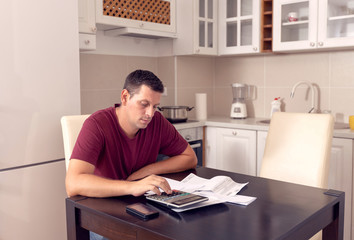 business man doing account about expenses at home, ..