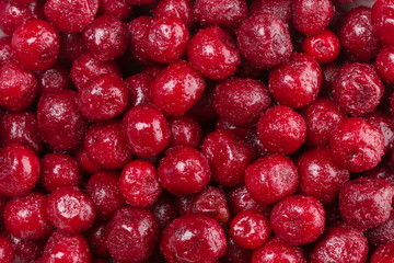 Frozen cherry fruit on a pile background