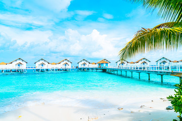 Obraz na płótnie Canvas Beautiful tropical Maldives resort hotel and island with beach and sea