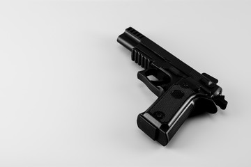gun on white background. - law, criminal and safety concept.