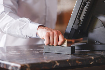 Hand Swiping Credit Card In Store.