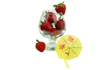 Fresh strawberry as a natural juice concept. Strawberry cocktail with tubule and umbrella.