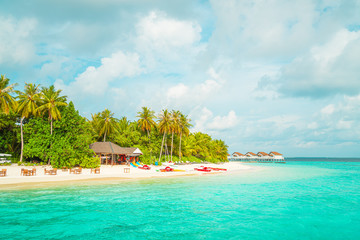 Beautiful tropical Maldives resort hotel and island with beach and sea