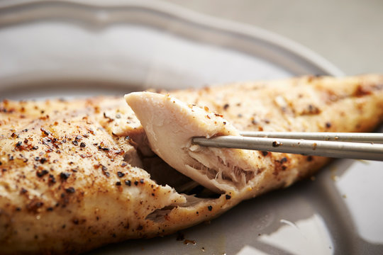 Grilled mackerel fish, eating with chopsticks